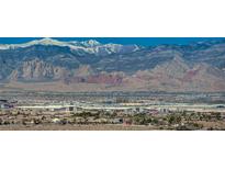 Wide shot of Las Vegas buildings and homes with scenic mountain range backdrop on a clear day at 8255 S Las Vegas Blvd # 2004, Las Vegas, NV 89123