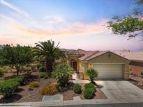 Single-story home with beautiful desert landscaping, gated courtyard and a two-car garage at 8409 Sherwood Park Dr, Las Vegas, NV 89131