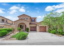 Charming two-story home with two-car garage, inviting entry and manicured landscaping at 11237 Newbury Hills Ave, Las Vegas, NV 89138