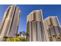 Three tall buildings with palm trees offer a resort-like atmosphere in a city setting at 135 E Harmon Ave # 518, Las Vegas, NV 89109