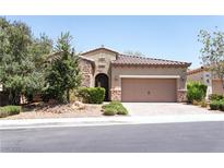 Charming single-story home featuring desert landscaping and a two-car garage at 2434 Quiet Ode St, Henderson, NV 89044