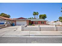 Charming single-story home featuring a two-car garage and a tidy, low-maintenance front yard at 2700 Osborne Ln, Henderson, NV 89014