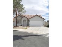 Charming single-story home featuring a two-car garage and a well-maintained front yard at 2721 Coffee Pot Ct, Las Vegas, NV 89106