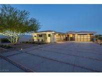 Stunning single story home with a modern design and elegant desert landscaping and oversized driveway at 4070 N Tee Pee Ln, Las Vegas, NV 89129