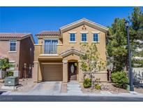 Charming two-story home featuring a balcony, two-car garage, and well-maintained landscaping at 433 Royal Bridge Dr, Las Vegas, NV 89178