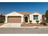 Charming single-story home with a desert-landscaped front yard and two-car garage at 4410 S Gressa St, Pahrump, NV 89061