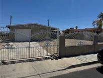 Charming home featuring a gated entrance, desert landscaping, and an attached single car garage at 4778 Beadle St, Las Vegas, NV 89122