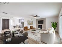 Bright, open-concept living and dining area features stylish furnishings and a modern fireplace at 516 Donner St, Las Vegas, NV 89107