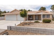Charming single-story home with a well-maintained front yard and a two-car garage at 5260 Styers St, North Las Vegas, NV 89031