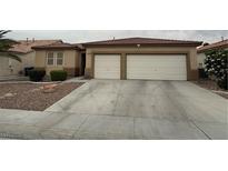 Charming single-story home with two-car garage and well-maintained landscaping at 5318 Rio Eldorado Ct, North Las Vegas, NV 89031