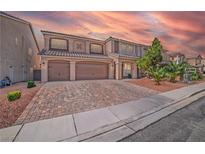 Stunning two-story home featuring a three-car garage and mature landscaping at 6453 Mount Eden Ave, Las Vegas, NV 89139