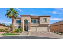 Beautiful two-story home with stone accents, balcony, and three-car garage at 7112 Rancho De Taos Ct, Las Vegas, NV 89130