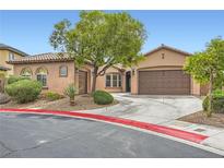 Charming single-story home with desert landscaping, mature trees, and a two-car garage at 7404 Eggshell Dr, North Las Vegas, NV 89084