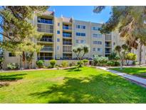 Multi-story condo building featuring balconies and landscaping at 745 N Royal Crest Cir # 127, Las Vegas, NV 89169