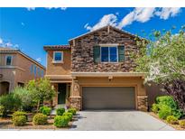 Inviting two-story home with a stone facade and manicured landscaping, plus an attached garage at 7624 Mallard Bay Ave, Las Vegas, NV 89179