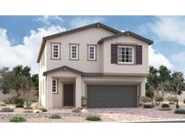 Charming two-story home featuring a two-car garage, neutral stucco, a covered entryway and a well-manicured yard at 9909 Angel Valley Dr, Las Vegas, NV 89178