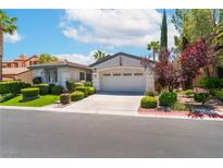 Charming single-story home featuring a two-car garage and beautifully landscaped front yard at 11405 Perugino Dr, Las Vegas, NV 89138
