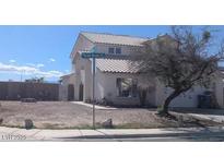 Charming two-story home features a tile roof and well-manicured landscaping at 2147 Bridle Wreath Ln, Las Vegas, NV 89156