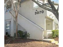 Inviting condo exterior featuring a private entrance and well-maintained landscaping at 3070 Tarpon Dr # 102, Las Vegas, NV 89120