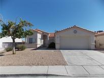 Charming single-story home featuring a low maintenance desert landscaped front yard at 319 Mulberry Glen Dr, North Las Vegas, NV 89031