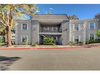Attractive two-story condo with stucco exterior and balcony entrance in a well-kept community at 3823 S Maryland Pkwy # P1, Las Vegas, NV 89119
