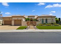 Charming single-story home featuring a courtyard, manicured landscaping, and a three-car garage at 4208 Agosta Luna Pl, Las Vegas, NV 89135