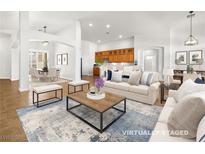 Spacious living room featuring hardwood floors, neutral paint, and lots of natural light at 5120 Mirage Garden St, Las Vegas, NV 89130