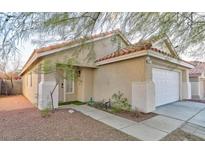 Charming single-story home featuring a terracotta tile roof and low maintenance desert landscaping in a suburban neighborhood at 6337 Canyon Vista Ct, Las Vegas, NV 89156