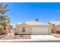 Charming single-story home featuring a well-manicured yard and a two-car garage at 7641 Sea Wind Dr, Las Vegas, NV 89128