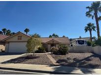 Charming single story home with a desert-landscaped front yard and a two-car garage at 837 Holly Lake Way, Henderson, NV 89002