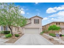 Charming two-story home featuring a two-car garage and low-maintenance landscaping at 9082 Amanda Creek Ct, Las Vegas, NV 89149