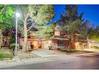 Charming home with well-maintained landscaping and a spacious three-car driveway, perfect for Gathering living at 9704 Royal Lamb Dr, Las Vegas, NV 89145