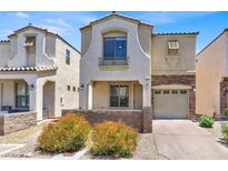 Inviting two-story home featuring a neutral color scheme, low-maintenance landscaping, and attached one-car garage at 10230 Viterbo St, Las Vegas, NV 89183