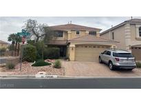 Charming two-story home with a tile roof, manicured landscaping, and a two-car garage at 10948 Carberry Hill St, Las Vegas, NV 89141