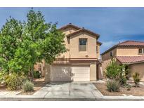Charming two-story home featuring a well-maintained front yard and attached two-car garage at 11177 Deluna St, Las Vegas, NV 89141