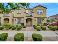 Charming townhome with a manicured front yard, sidewalk, and inviting entrance showcasing the lovely curb appeal at 1200 Paradise Basin Ct, Henderson, NV 89002