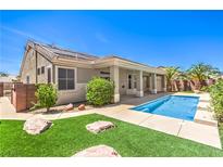 A private backyard pool with well manicured landscaping and desert-friendly rock features at 2158 High Mesa Dr, Henderson, NV 89012