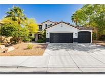 Charming two-story home with a three-car garage and well-maintained landscaping at 25 Blue Valley Dr, Henderson, NV 89002