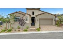 Charming single-story home featuring a well-manicured front yard and an inviting gated entryway at 281 Gandara St, Las Vegas, NV 89138
