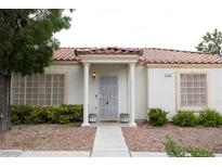 Charming single-story home with stucco siding and a tile roof. Covered entryway with decorative columns at 5400 Tassara Way # 106, Las Vegas, NV 89108