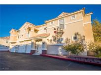 Attractive two-story home with a red-tiled roof and ample parking spaces at 5855 Valley Dr # 2161, North Las Vegas, NV 89031