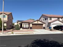 Charming single-story home featuring a well-maintained front yard, two-car garage, and inviting curb appeal at 8237 Cline Mountain St, Las Vegas, NV 89131