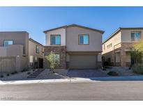 Beautiful two-story home with stone accents, a two-car garage, and a landscaped front yard at 9239 Albus Hills Ave, Las Vegas, NV 89143
