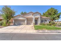 Charming single-story home with a well-manicured lawn and a three-car garage at 1088 Casady Hollow Ave, Henderson, NV 89012