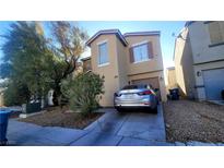 Charming two-story home with desert landscaping, a driveway, and an attached garage at 2131 Pillar Pointe St, Las Vegas, NV 89115