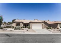 Charming single-story home featuring a two-car garage and xeriscaped front yard at 2501 Maddington Dr, Las Vegas, NV 89134
