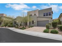 Modern two-story home with neutral color palette, desert landscaping, and a two-car garage at 3005 Merlesco Ave, Henderson, NV 89044