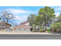 Charming two-story home with a three car garage and well-maintained landscaping at 3396 Montessouri St, Las Vegas, NV 89117
