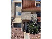 Two-story home with desert landscaping, red tile roof, and a private entrance via outdoor stairs at 3585 Arville St # 401A, Las Vegas, NV 89103