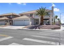 Charming two-story home featuring a two-car garage, desert landscaping, and a lovely second-floor balcony at 3604 N Campbell Rd, Las Vegas, NV 89129